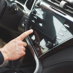 Man includes an audio system in the car