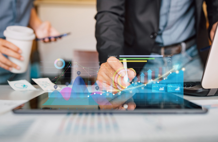 businessman-analyzing-company-financial-report-with-augmented-reality-graphic_34141-701