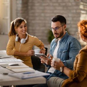 team-young-entrepreneurs-having-business-meeting-office-focus-is-businessman-using-digital-tablet_637285-2014